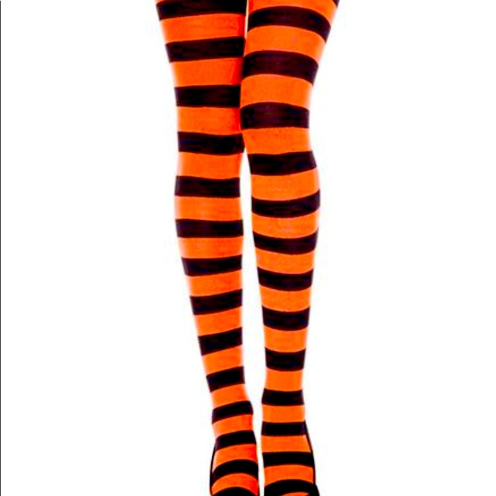 Orange & Black striped women’s Halloween tights In various sizes.